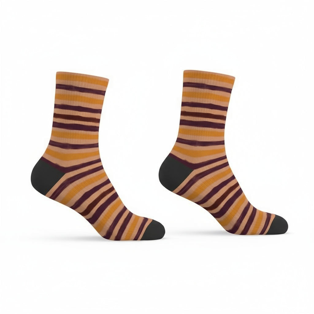 Pair of striped socks with orange, purple, and black colors on a white background